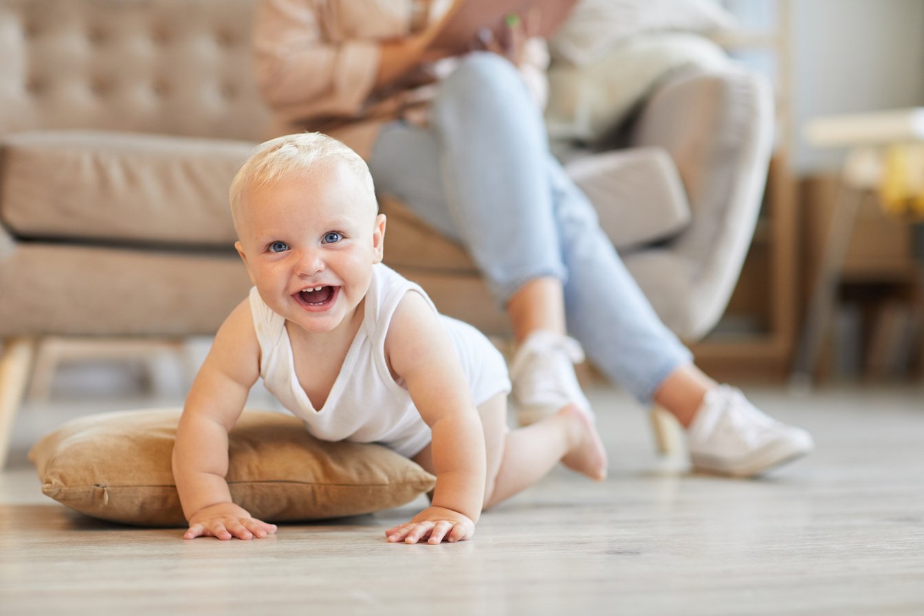 Happy Baby Crawling on Floor